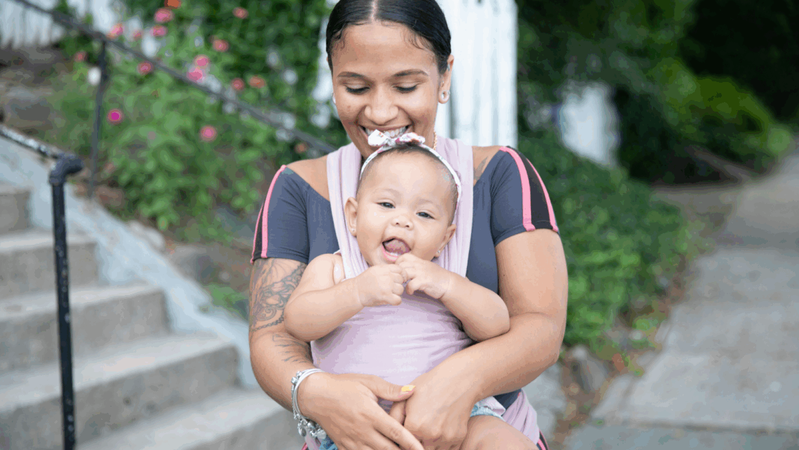 no pressure fitness mom holding baby